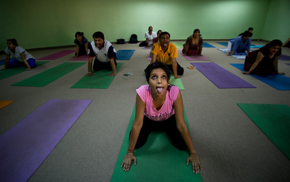 आंतरराष्ट्रीय योगदिन! People perform yoga at the Morarji Desai National Institute of Yoga, in New Delhi.

