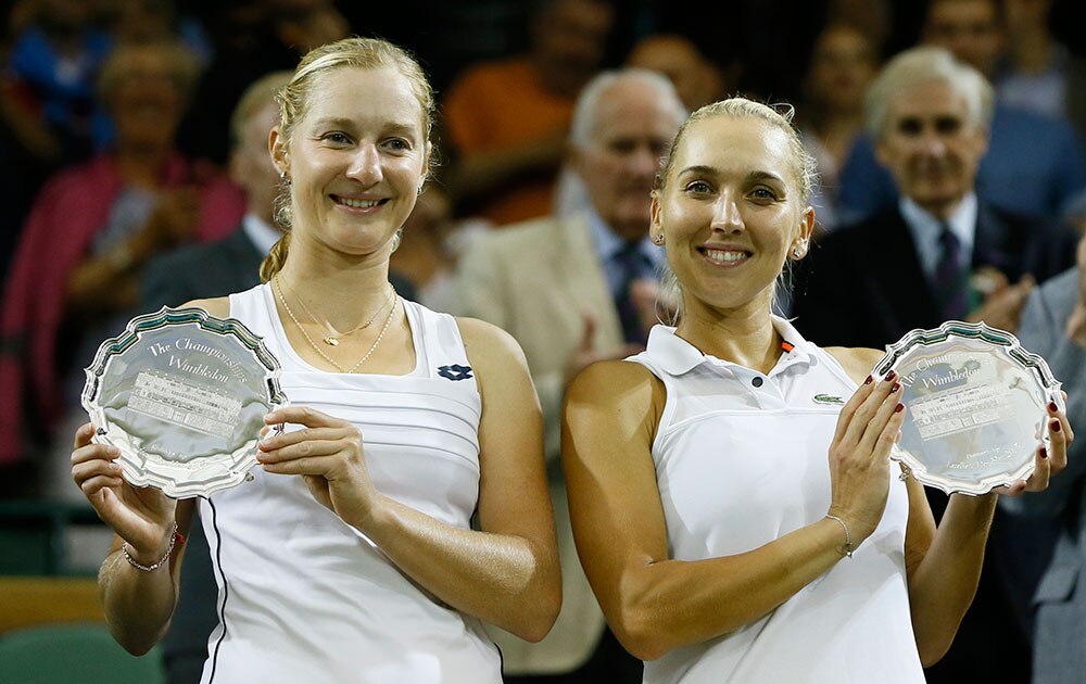 EKATERINA MAKAROVA OF RUSSIA, LEFT, AND ELENA VESNINA OF RUSSIA HOLD THEIR RUNNER UP TROPHIES
