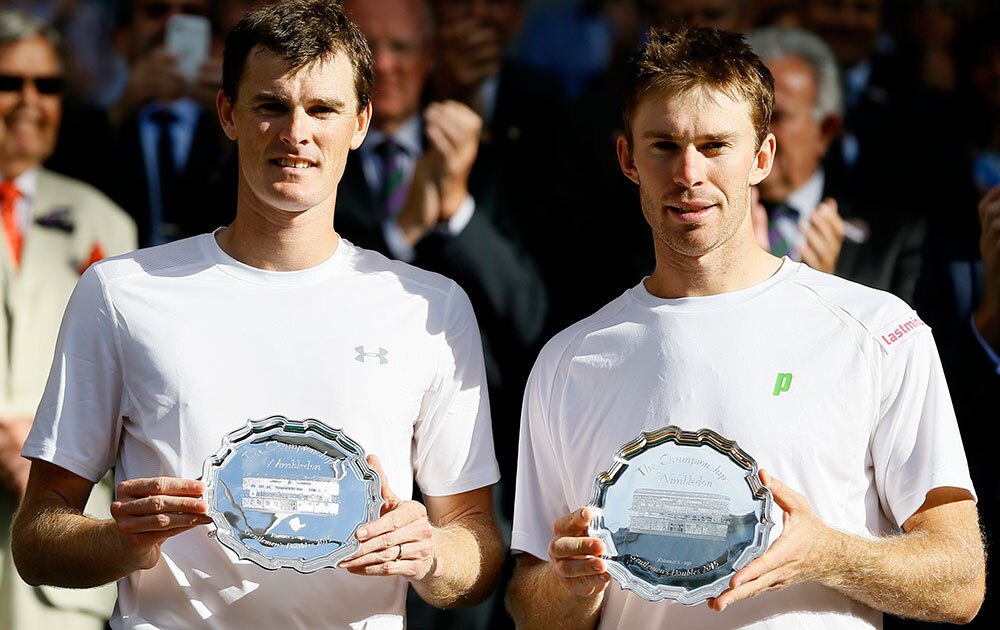 JAMIE MURRAY OF BRITAIN, LEFT, AND JOHN PEERS OF AUSTRALIA HOLD THEIR RUNNERS UP TROPHIES
