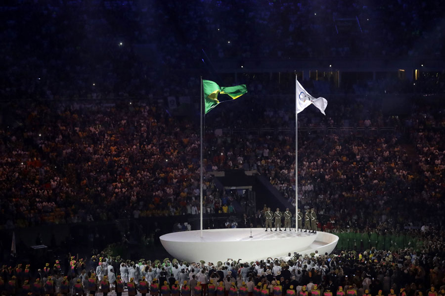 The Olympic and Brazil flag fly