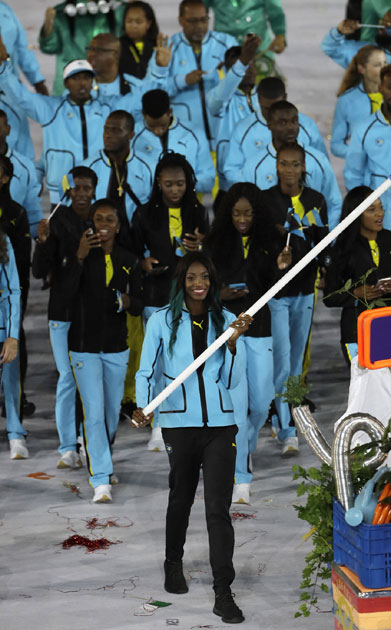 Shaune Miller carries the flag of Bahamas