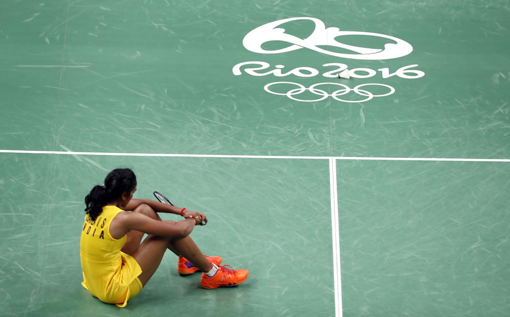 India`s V. Sindhu Pusarla sits on the court