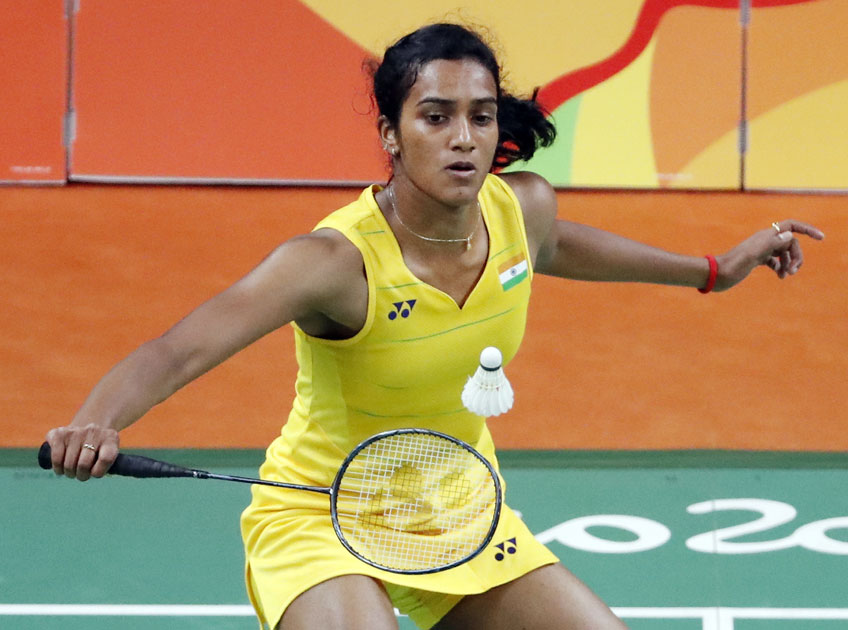 India`s V. Sindhu Pusarla returns a shot to Carolina Marin