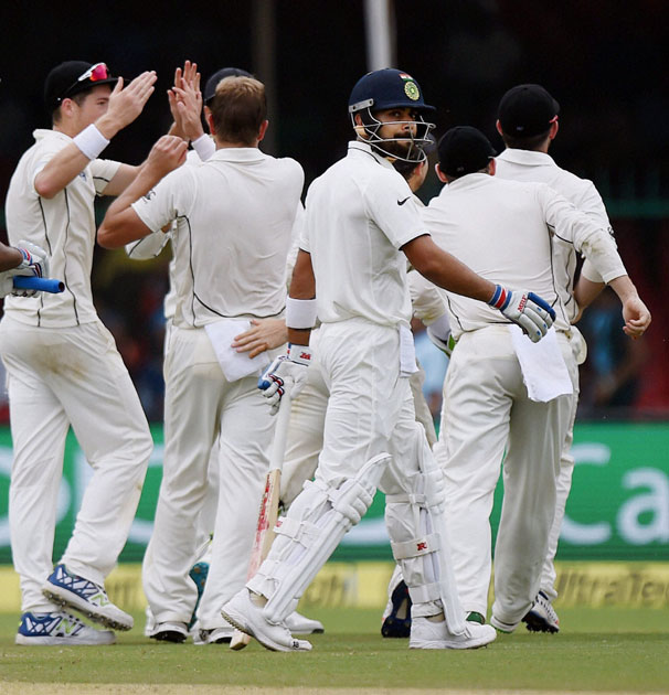 Virat Kohli walks to the pavilion