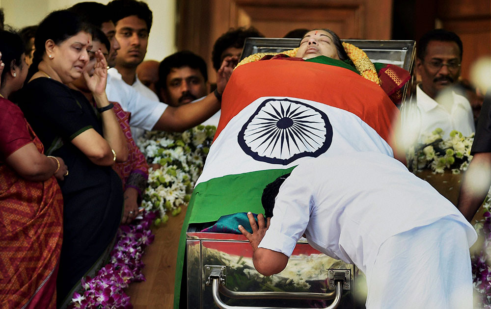 Tamil Nadu Chief Minister O Pannerselvam paying his last respects to his leader and former Chief Minister J Jayalalithaa at Rajaji Hall in Chennai