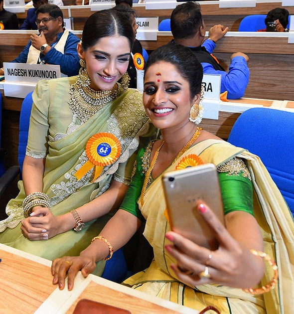 Best actress award winner Surabhi Jyoti takes selfie with actress Sonam Kapoor at the 64th National Film Awards function