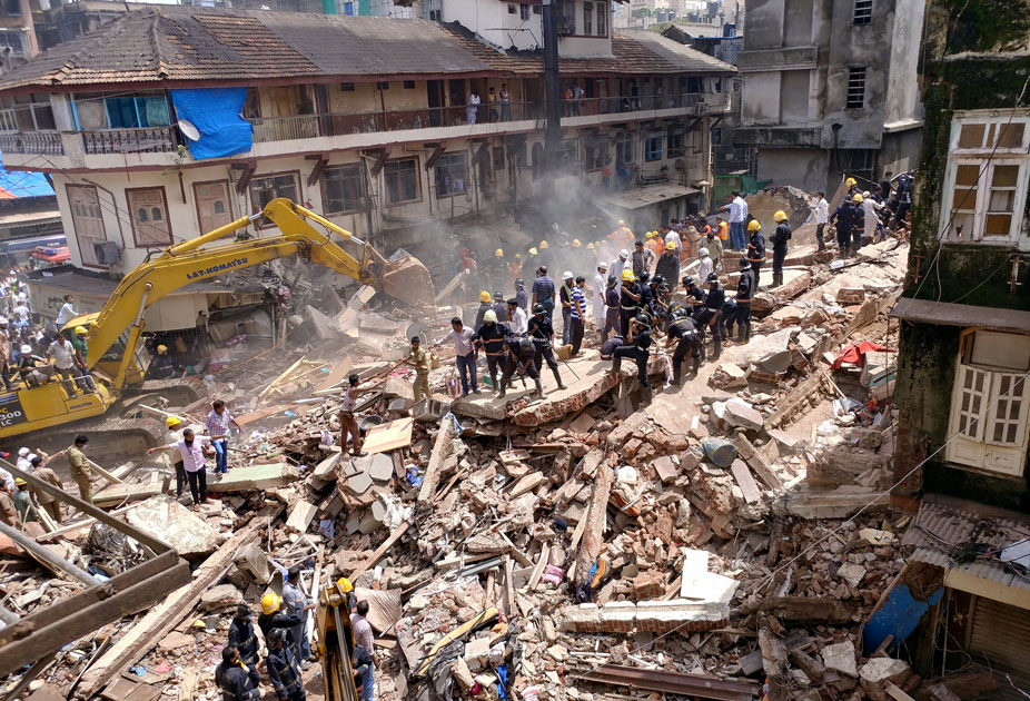 Firefighters and rescue workers search for survivors