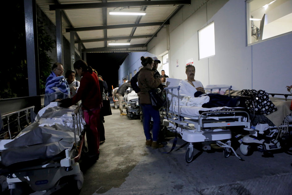 Patients and family members are seen outside the ISSSTE after an earthquake