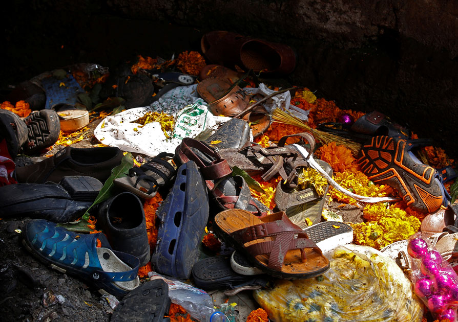 Footwear of the victims of a stampede are seen below a railway station`s pedestrian overbridge in Mumbai.