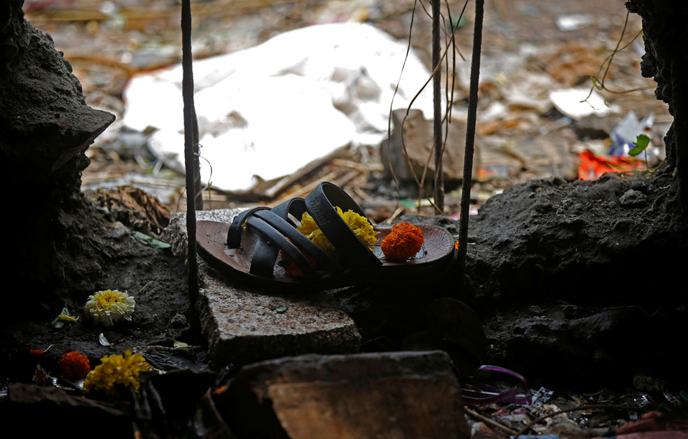 A sandle of one of the victims of a stampede is seen below a railway station`s pedestrian overbridge in Mumbai.