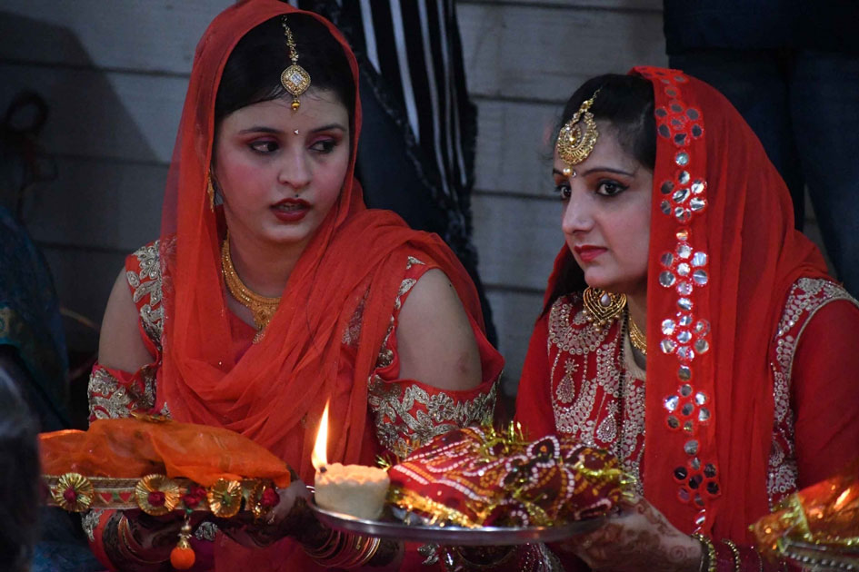 Women perform rituals related to Karva Chauth in Patna