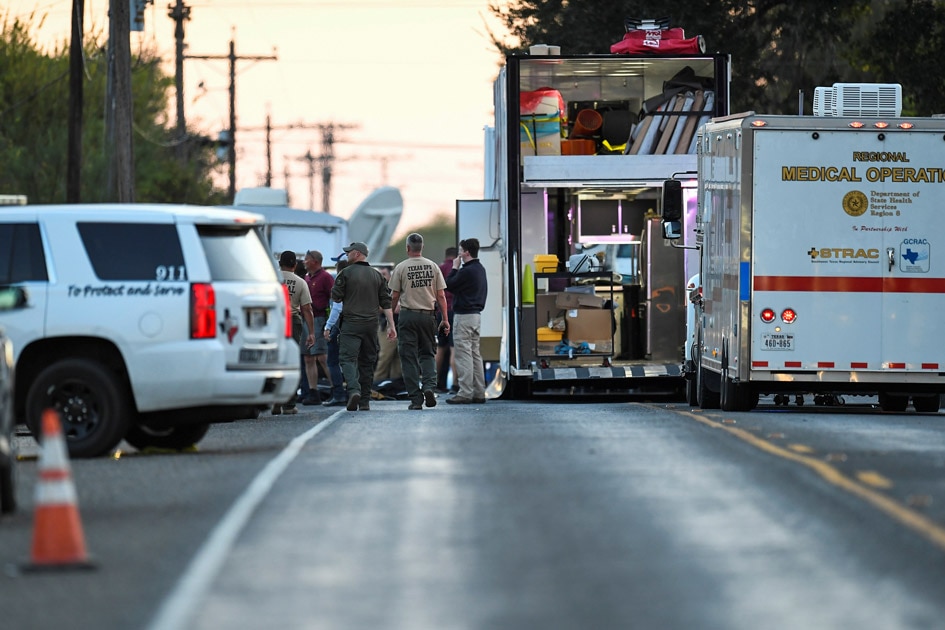 Medical personnel and law enforcement set up along a street near the First Baptist Church in Sutherland Springs, Texas.