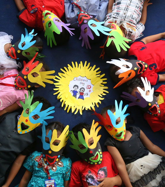 Nepalese children pose for photos as they celebrate the National Children`s Day in Kathmandu, Nepal.