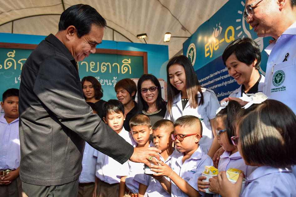 Thai Prime Minister Prayuth Chan-ocha gives presents to kids during a Children`s Day celebration at the Sanam Suea Pa Park in Bangkok, Thailand.