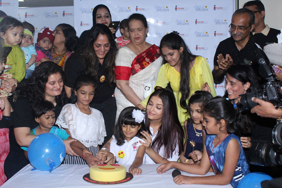 1Actress Aishwarya Rai Bachchan along with her mother Brindya Rai, daughter Aaradhya Bachchan and children born with cleft lips and palates of `Smile Train` celebrates her father Krishnaraj Rai`s birth anniversary at Shushrusha Hospital, in Mumbai.