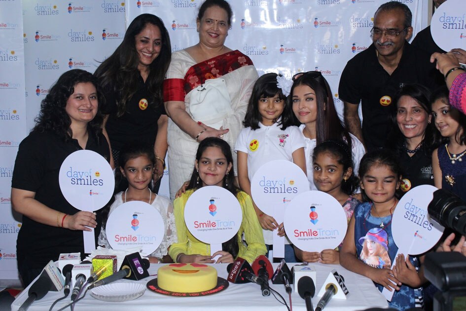 2Actress Aishwarya Rai Bachchan along with her mother Brindya Rai, daughter Aaradhya Bachchan and children born with cleft lips and palates of `Smile Train` celebrates her father Krishnaraj Rai`s birth anniversary at Shushrusha Hospital, in Mumbai.