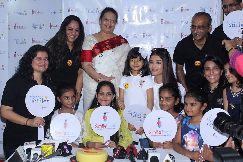 3Actress Aishwarya Rai Bachchan along with her mother Brindya Rai, daughter Aaradhya Bachchan and children born with cleft lips and palates of `Smile Train` celebrates her father Krishnaraj Rai`s birth anniversary at Shushrusha Hospital, in Mumbai.