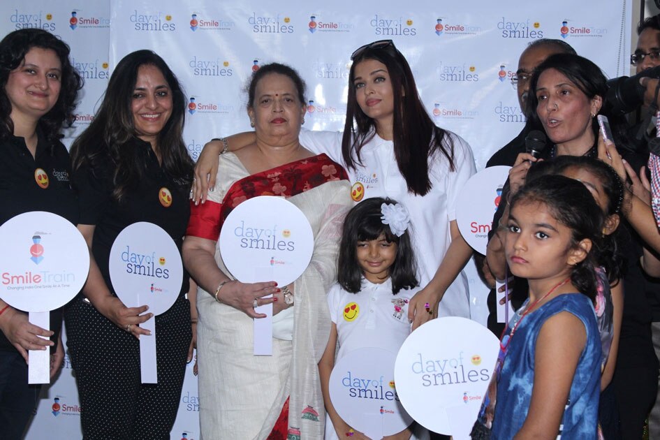 4Actress Aishwarya Rai Bachchan along with her mother Brindya Rai, daughter Aaradhya Bachchan and children born with cleft lips and palates of `Smile Train` celebrates her father Krishnaraj Rai`s birth anniversary at Shushrusha Hospital, in Mumbai.