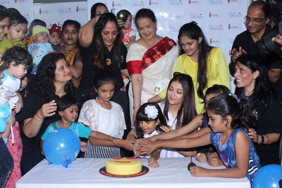 7Actress Aishwarya Rai Bachchan along with her mother Brindya Rai, daughter Aaradhya Bachchan and children born with cleft lips and palates of `Smile Train` celebrates her father Krishnaraj Rai`s birth anniversary at Shushrusha Hospital, in Mumbai.