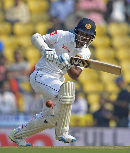 Sri Lankan batsman Dimuth Karunaratne plays a shot during the 2nd test match played against India in Nagpur.