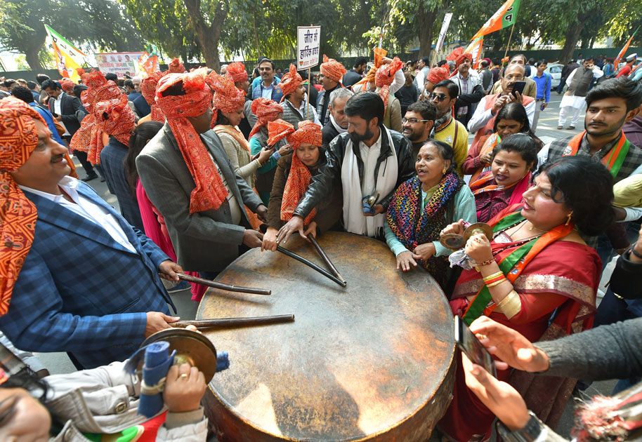 Party workers and supporters celebrating BJP’s success in Gujarat and Himachal Pradesh State assembly election outside the BJP headquarte, in New Delhi.