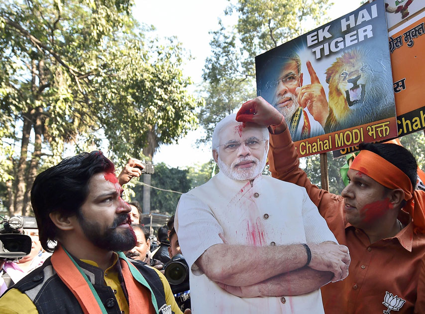 Party workers and supporters celebrating BJP`s success in the Gujarat and Himachal Pradesh state assembly elections outside the BJP headquarter, in New Delhi.