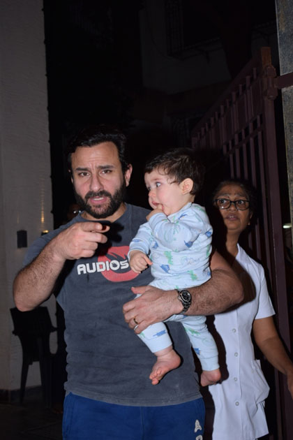 Actor Saif Ali Khan along with his son Taimur Ali Khan at Actress Soha Ali khan`s residence on the occasion of her birthday in Mumbai.