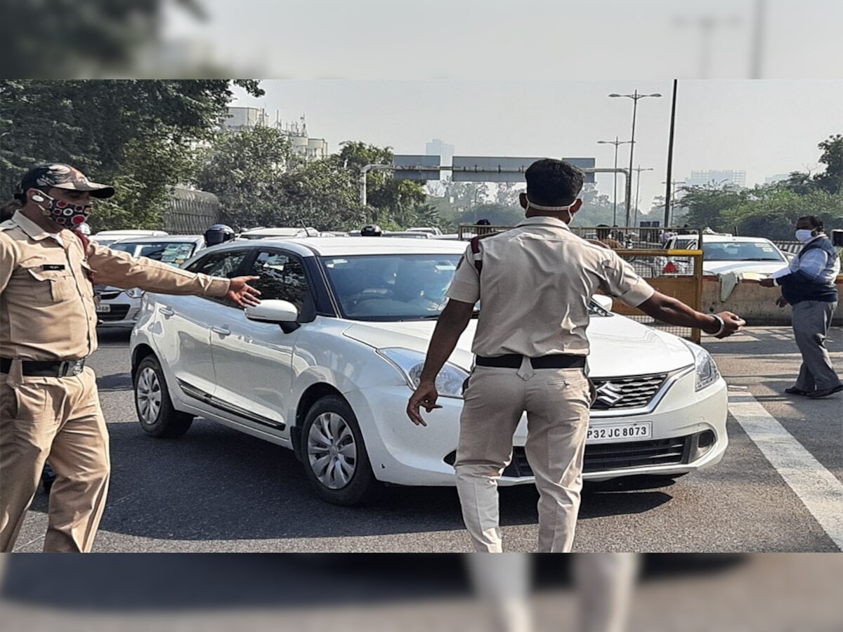 दिल्लीत कोरोनाची दुसरी लाट; मास्क नसेल तर कार, बस थांबवून पोलीस कारवाई title=