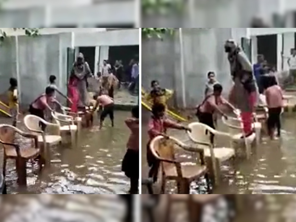 Video: शाळेच्या आवारात साचलं पाणी, मुलांनी शिक्षिकेला असं काढलं बाहेर  title=