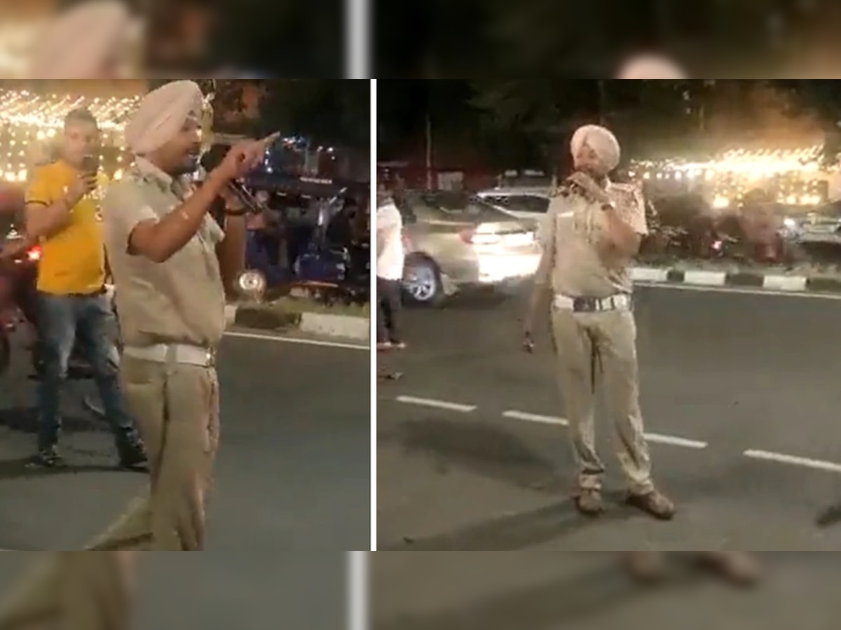 Video: रस्त्याच्या मधोमध उभं राहून पोलीस कर्मचाऱ्यानं गायलं गाणं, बोल ऐकून तुम्हीही म्हणाल; क्या बात है! title=