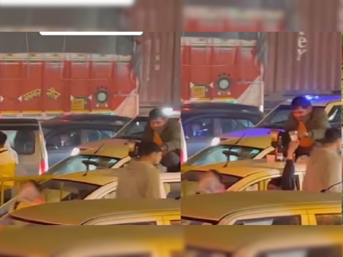 Viral Video : भर रस्त्यात गाडीच्या छतावरून बसून मारले पेग वर पेग, व्हिडिओ व्हायरल title=