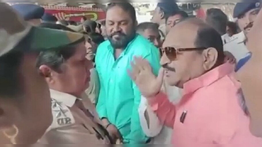 BJP Leader Jaynarayan Mishra assaults a woman police officer pushed in ...