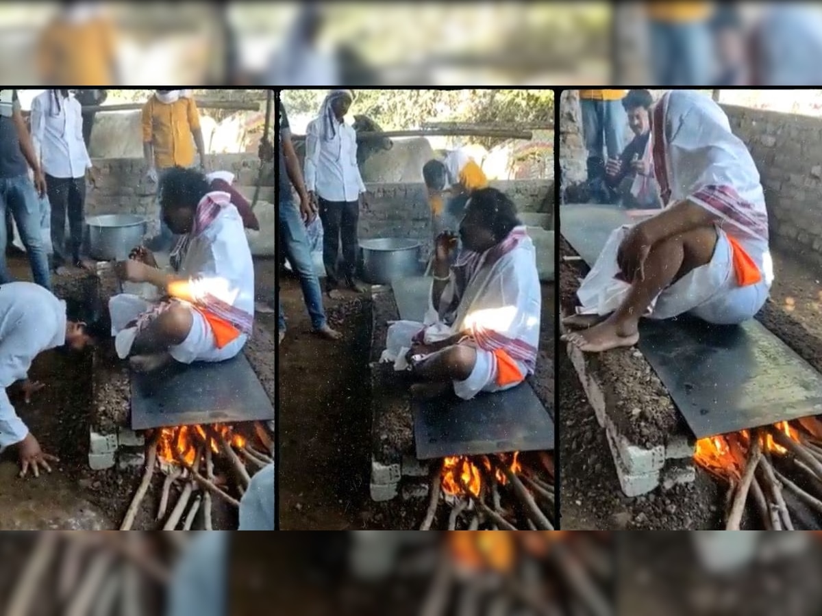 Video Viral : गरम तव्यावर बसून भक्तांना शिवीगाळ करणाऱ्या बाबा गायब; भक्तांनी केला अजब दावा title=