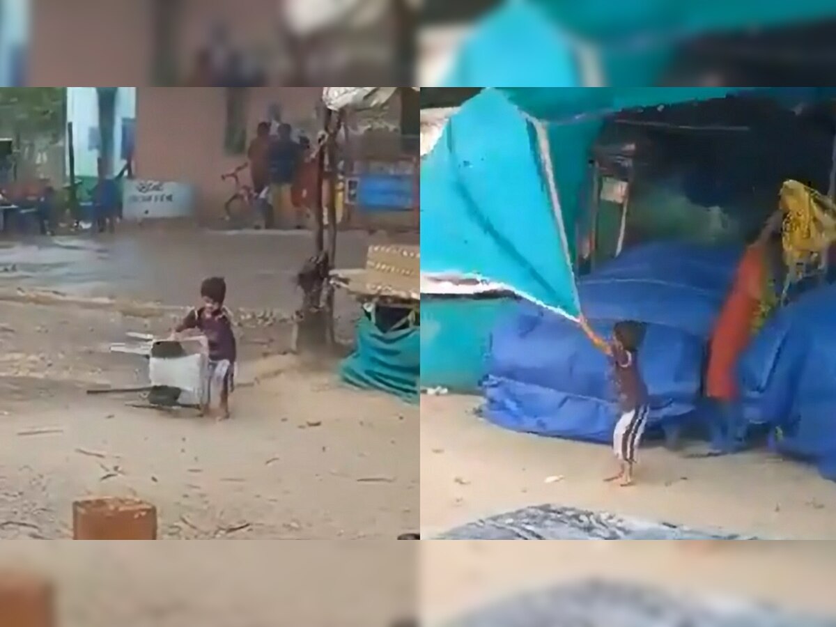 Viral Video: वादळात चिमुरड्याची आईसह दुकान वाचवण्यासाठी धडपड; VIDEO पाहून डोळे पाणावतील title=