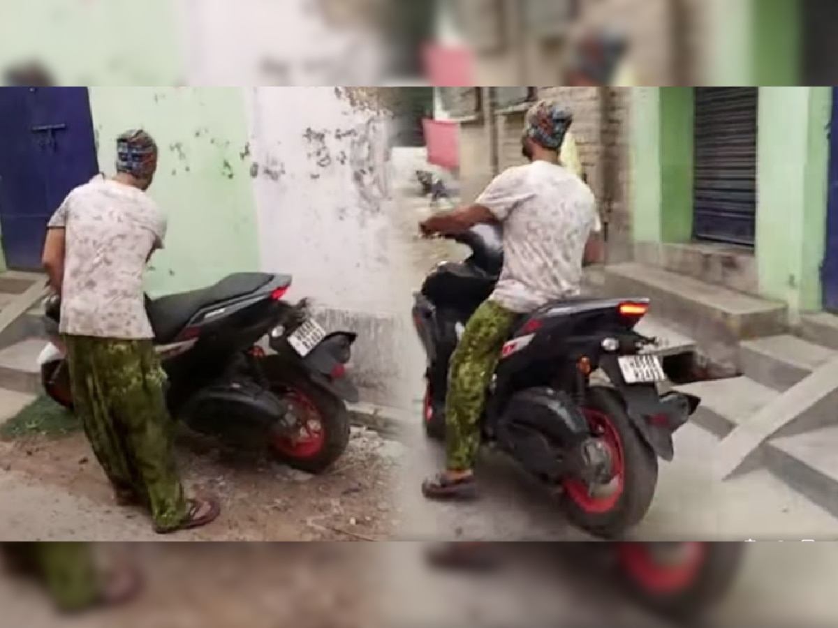 Viral Video: किराणामाल खरेदीसाठी Scooter वरुन जाणाऱ्या या व्यक्तीला ओळखलं का? अनेकांनी केलं कौतुक title=