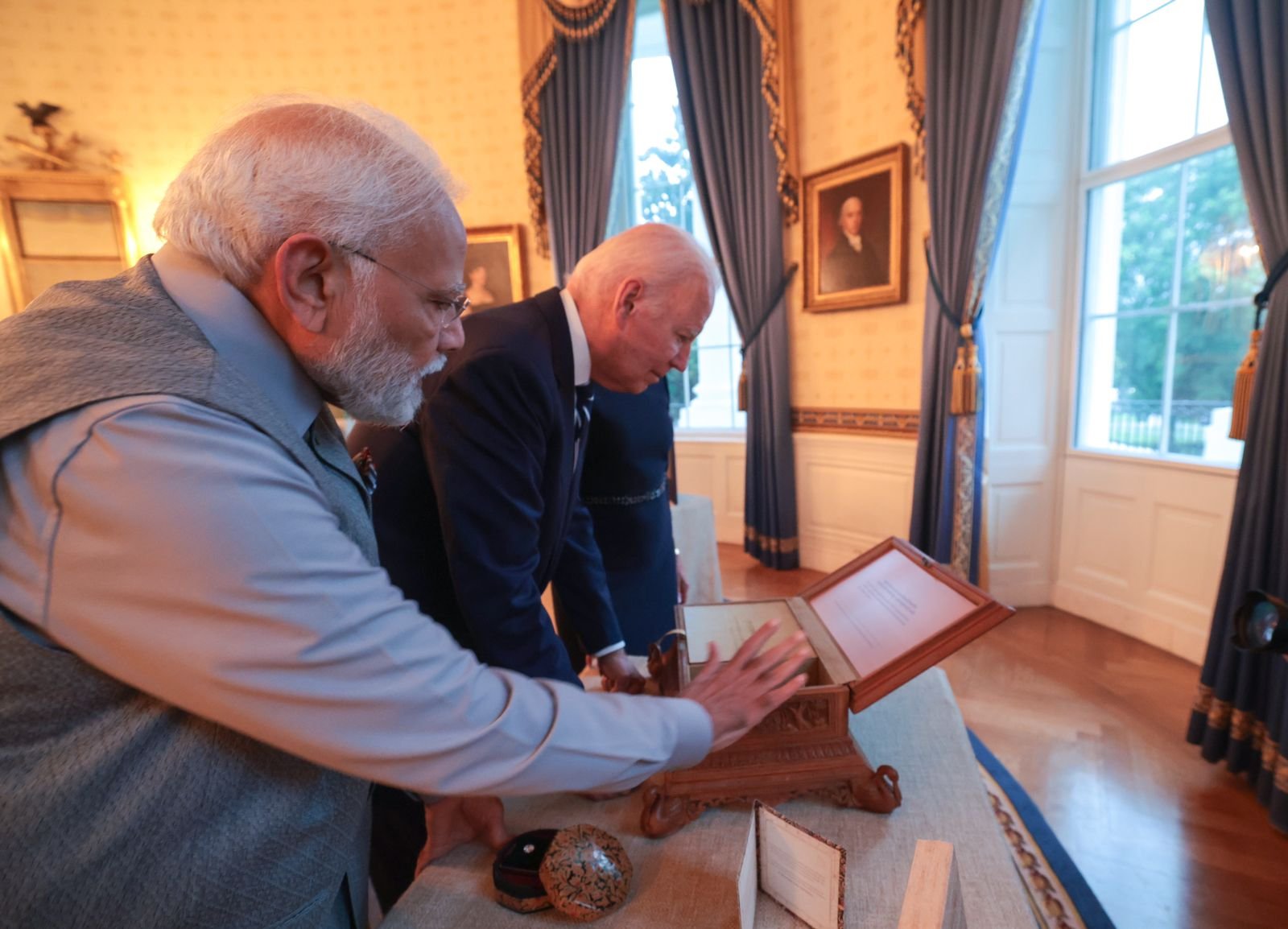 Prime Minister Narendra Modi presents a special sandalwood box to US President Joe Biden