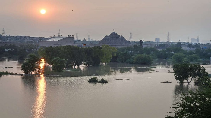 yamuna water level increases resulting water loging near supreme court rajghat and red fort photos 