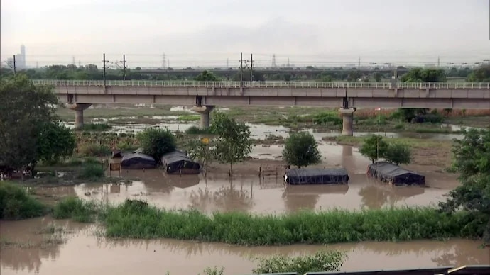 yamuna water level increases resulting water loging near supreme court rajghat and red fort photos 