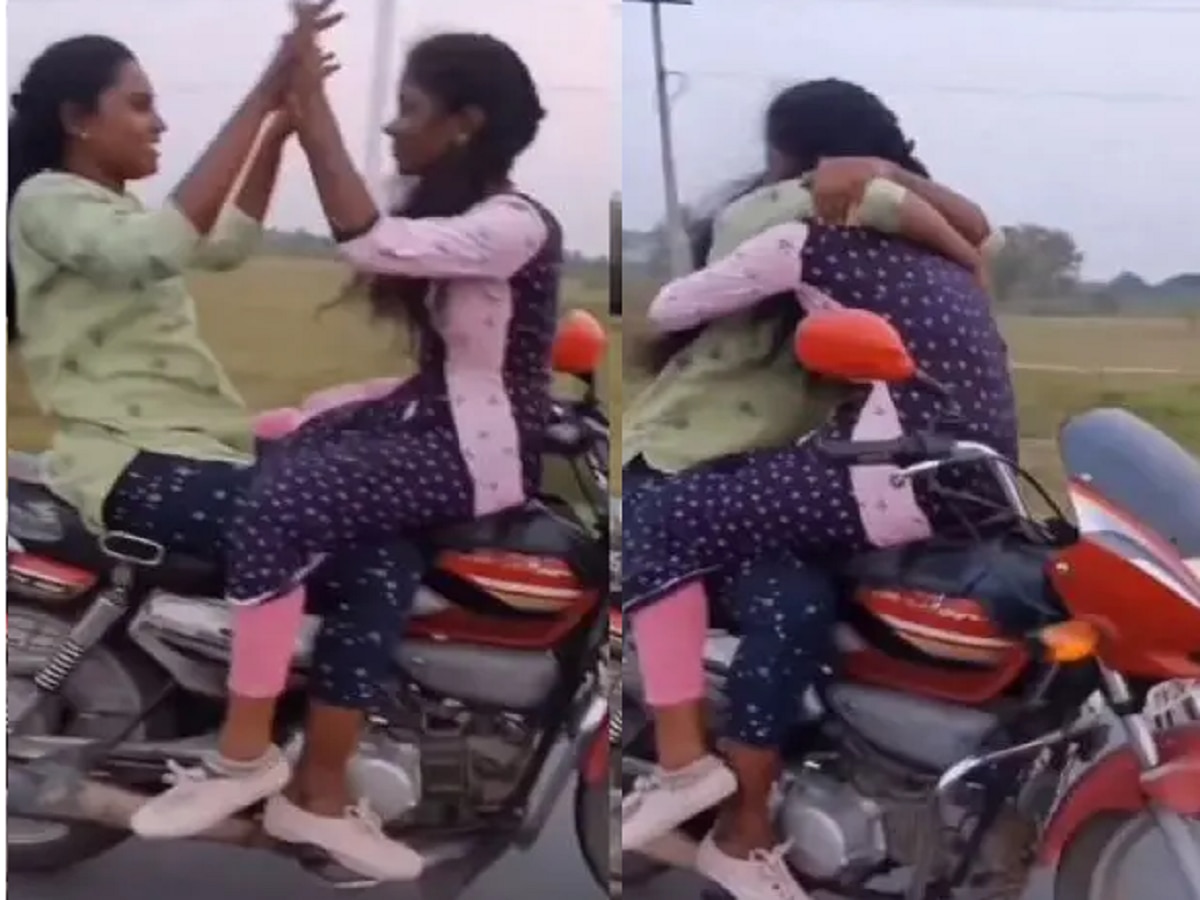 धावत्या बाईकवर दोन तरुणींचे अश्लील चाळे, liplock करतानाचा Video Viral title=