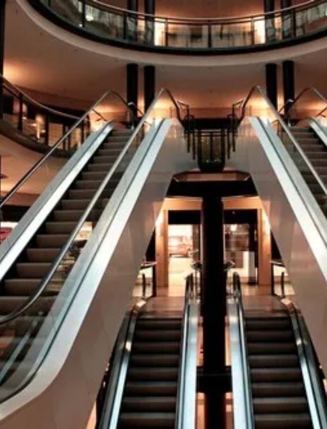 why escalators have brushes in sides 