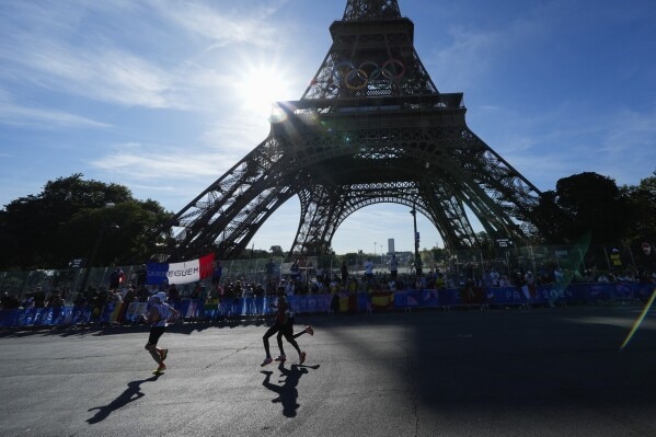 Man Climbing Eiffel Tower