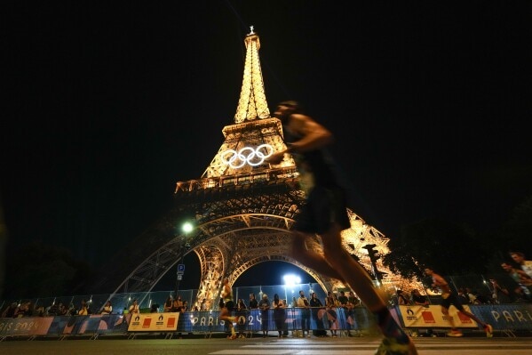 Man Climbing Eiffel Tower