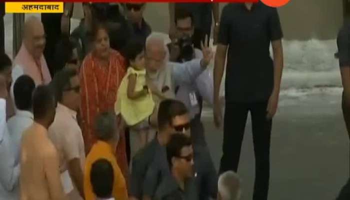  PM Modi Votes In Ahmedabad,Plays With Amit Shah_s Grand Daughter As Crowd Cheers