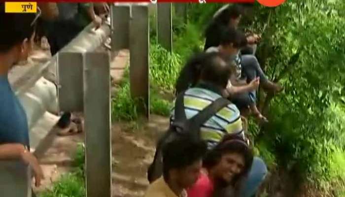 Pune After Heavy Rainfall People Putting Life In Danger And Entering Dam Water