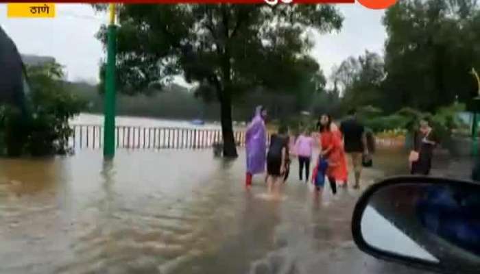 Thane As Upvan Lake Overflow People People And Small Childrens Playing In Water Ground Report