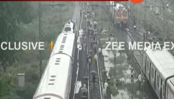 Mumbai People Walking On Railway Tracks As Central Railway Derailed