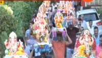 दीड दिवसांच्या बाप्पांना वाजतगाजत निरोप; पावसाचीही दमदार हजेरी 