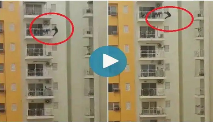 असं धाडस करु नका! 12 व्या मजल्यावर बाल्कनीला लटकून ही व्यक्ती काय करतेय पाहा, VIDEO व्हायरल