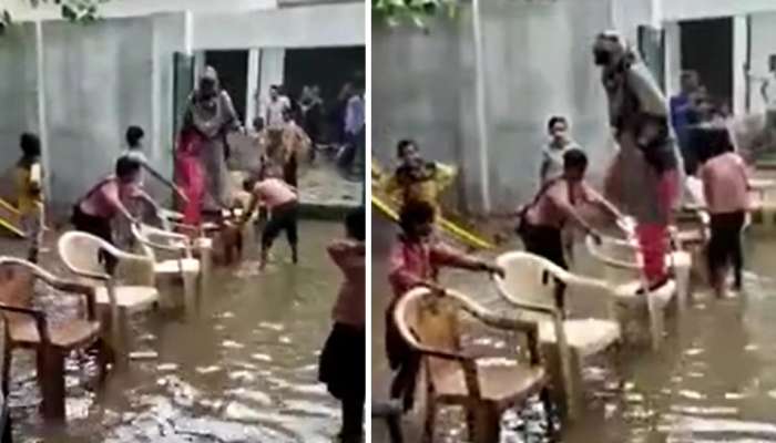 Video: शाळेच्या आवारात साचलं पाणी, मुलांनी शिक्षिकेला असं काढलं बाहेर 