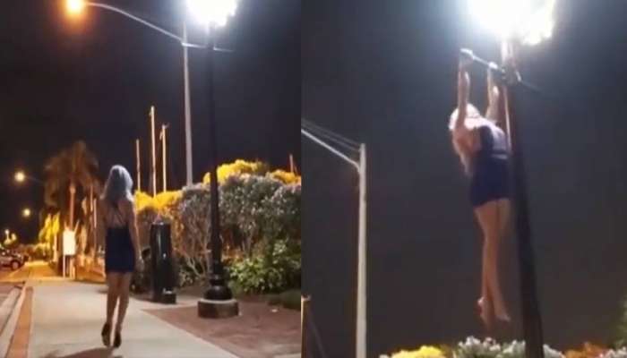 Video : बॅकलेस मिनी ड्रेसमध्ये तरुणीचा वर्कआऊट; खांबावर चढत काढले पुलअप्स 